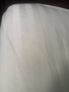 satin sheets in home on bed