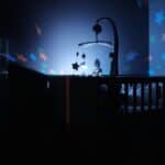 a star projector over a crib