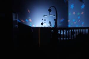 a star projector over a crib