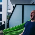 someone yawning mid day on patio