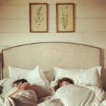a couple sleeping in bed