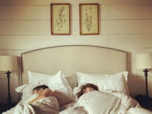 a couple sleeping in bed