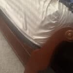 a bed frame on a mattress setup for bedroom