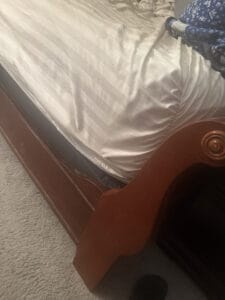 a bed frame on a mattress setup for bedroom