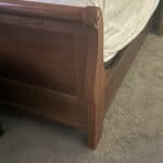 a bed frame with a mattress