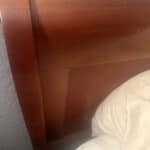 a headboard on a bed frame in home