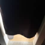 a blackout curtain in doorway cut off short