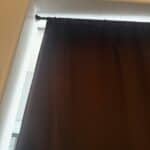 a blackout curtain hanging from no drill rod