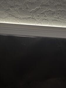a blackout curtain leaking sunlight