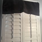 blackout curtain intertwined in shutters