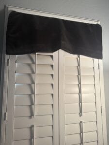 blackout curtain intertwined in shutters
