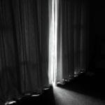 a blackout curtain in bedroom dark