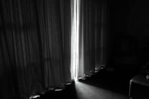 a blackout curtain in bedroom dark