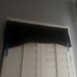 a blackout curtains on shutters to block out heat from summer