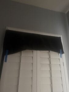 a blackout curtains on shutters to block out heat from summer