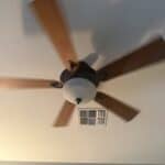 a ceiling fan spinning in bedroom