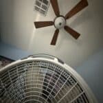 a ceiling fan and a floor fan for bedroom setup