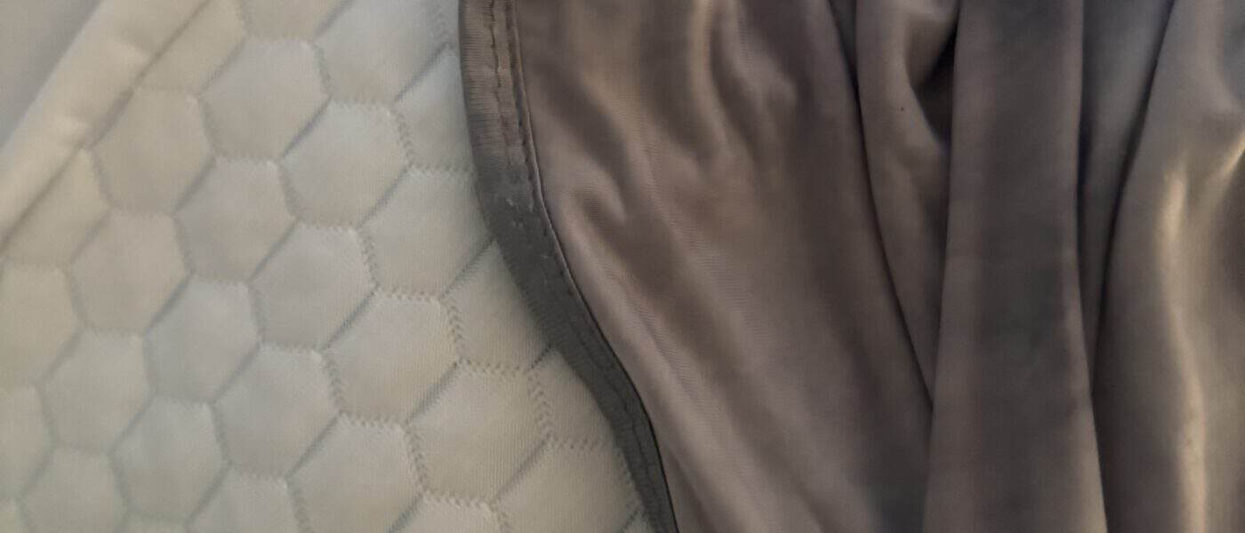 Can You Use a Cooling Blanket and a Cooling Topper Together? Solve Your Heat Problem