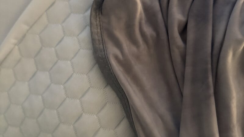 Can You Use a Cooling Blanket and a Cooling Topper Together? Solve Your Heat Problem