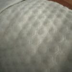 a cooling pillow in bed fluffed