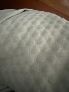 a cooling pillow in bed fluffed