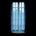 a dark bedroom glass door curtains