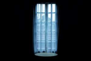 a dark bedroom glass door curtains
