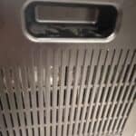 a dehumidifier in home back of the machine