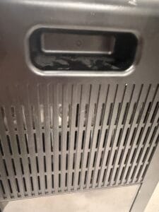 a dehumidifier in home back of the machine