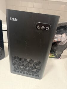 a dehumidifier full machine upclose on counter in home