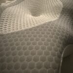 a firm cervical pillow in bed