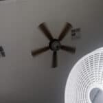flash photo of both ceiling fan and a floor fan