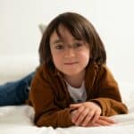 a kid on a mattress in home