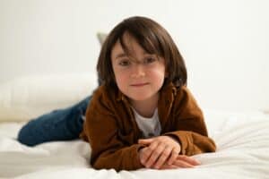 a kid on a mattress in home