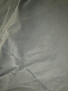 a lightweight comforter upclose on bed