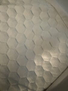 a mattress topper on bed in a bedroom