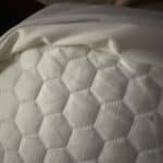 cooling mattress topper on bed for in home climate control