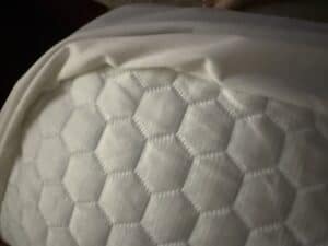 cooling mattress topper on bed for in home climate control