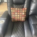 throw pillow sitting in recliner