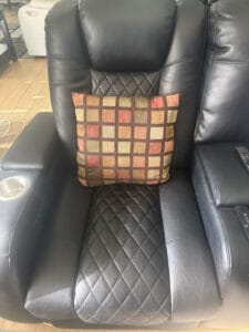 throw pillow sitting in recliner
