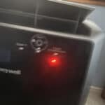 top corner of a portable ac with power button visible