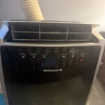 a portable ac fan upclose in bedroom