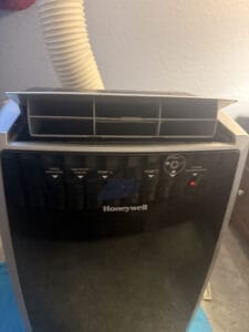a portable ac fan upclose in bedroom