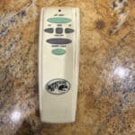 a remote for a ceiling fan on countertop