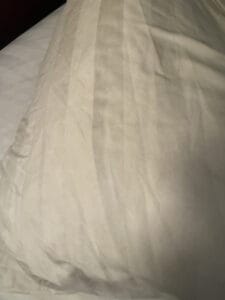 a satin pillowcase on a cooling pillow