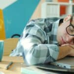 someone napping at desk