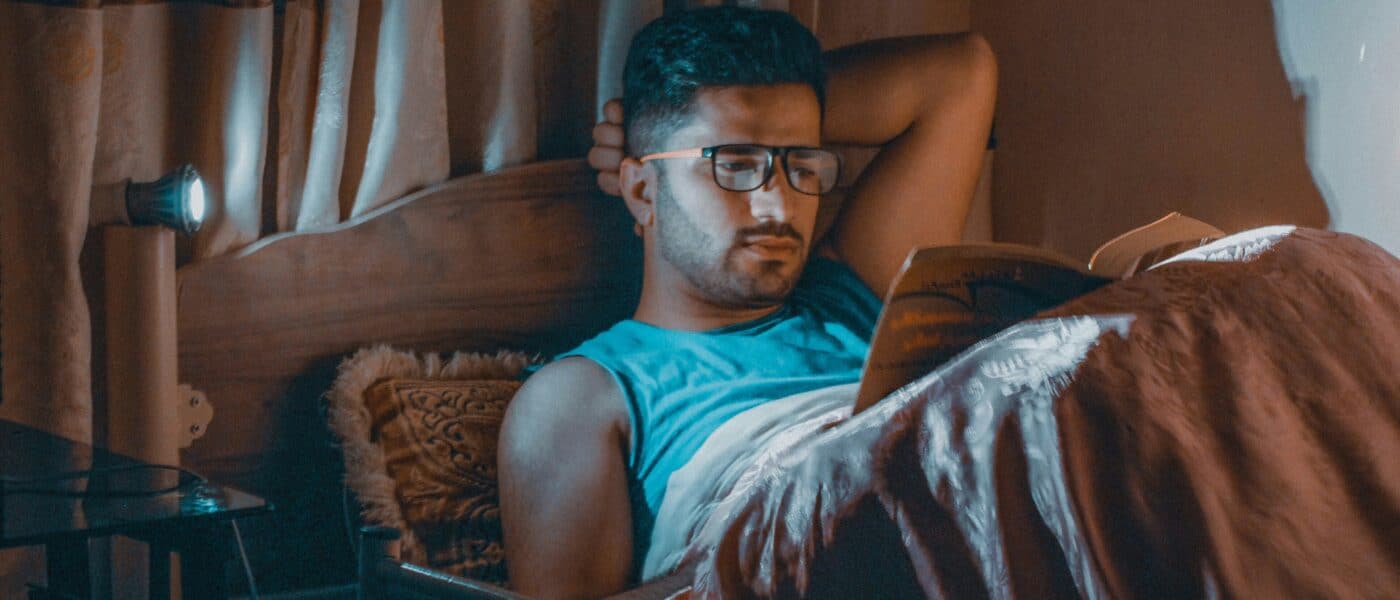 Best Sleep Gear for People Who Read in Bed in 2026: Neck Angle, Light, and Not Waking Anyone