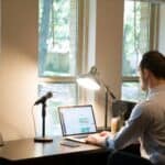 someone working from home remotely on computer