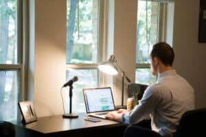 someone working from home remotely on computer
