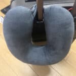 travel pillow latched on to luggage